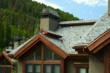 DaVinci polymer roofing tiles with blue in the color blend mixture complements this mountain setting.